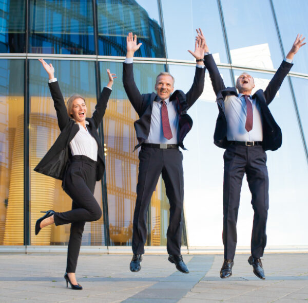 Happy excited business people celebrating success together, jumping and shouting. Full length, front view. Successful team and teamwork concept